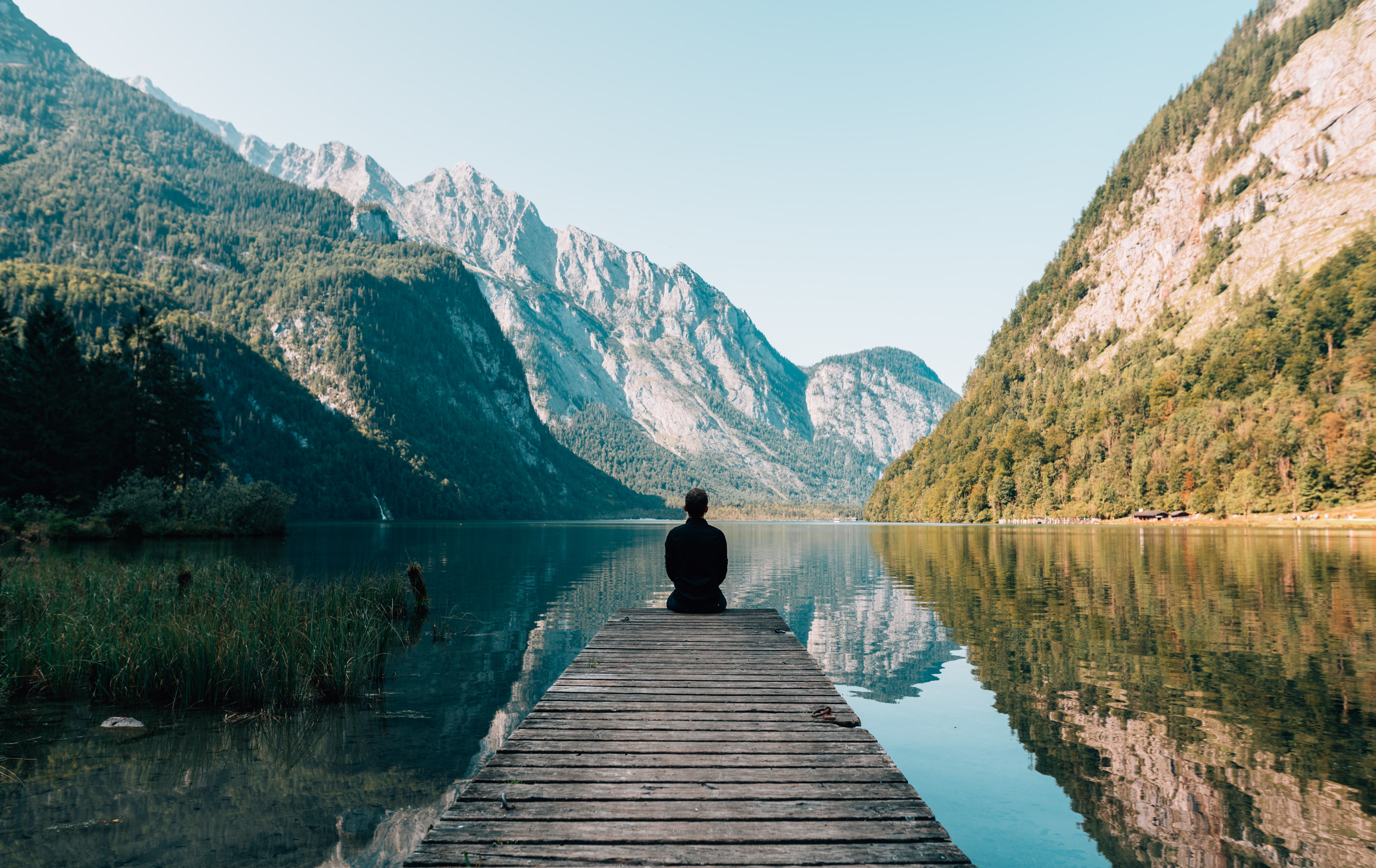 man sitting by himself practicing mindfulness